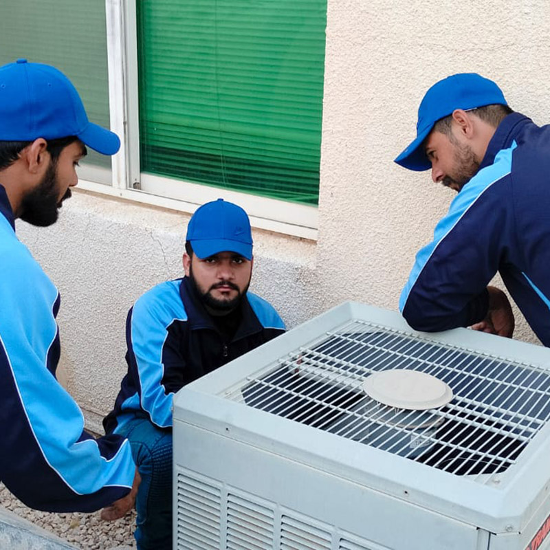 HVAC technician servicing an air conditioning unit